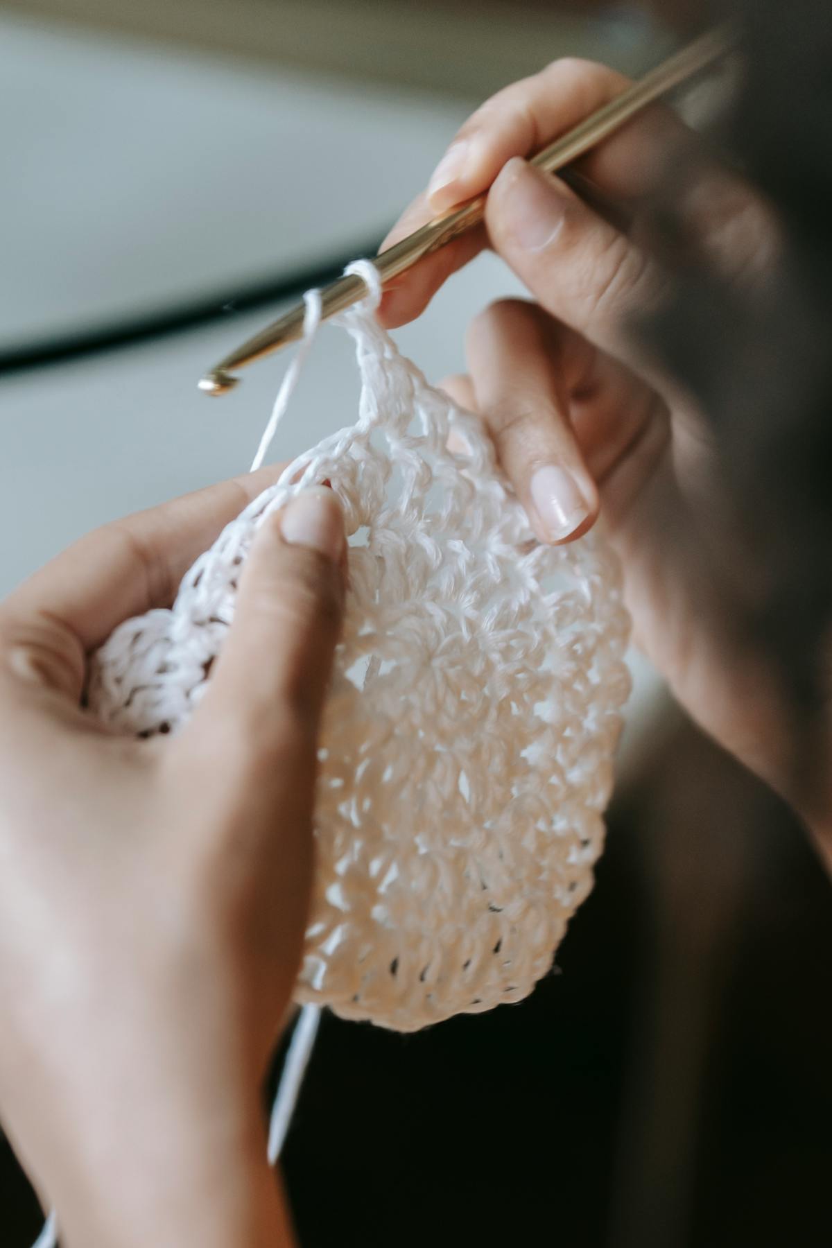 Kenza crocheting a bag